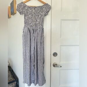 Off-shoulder smock cropped leg jumpsuit in black and white striple